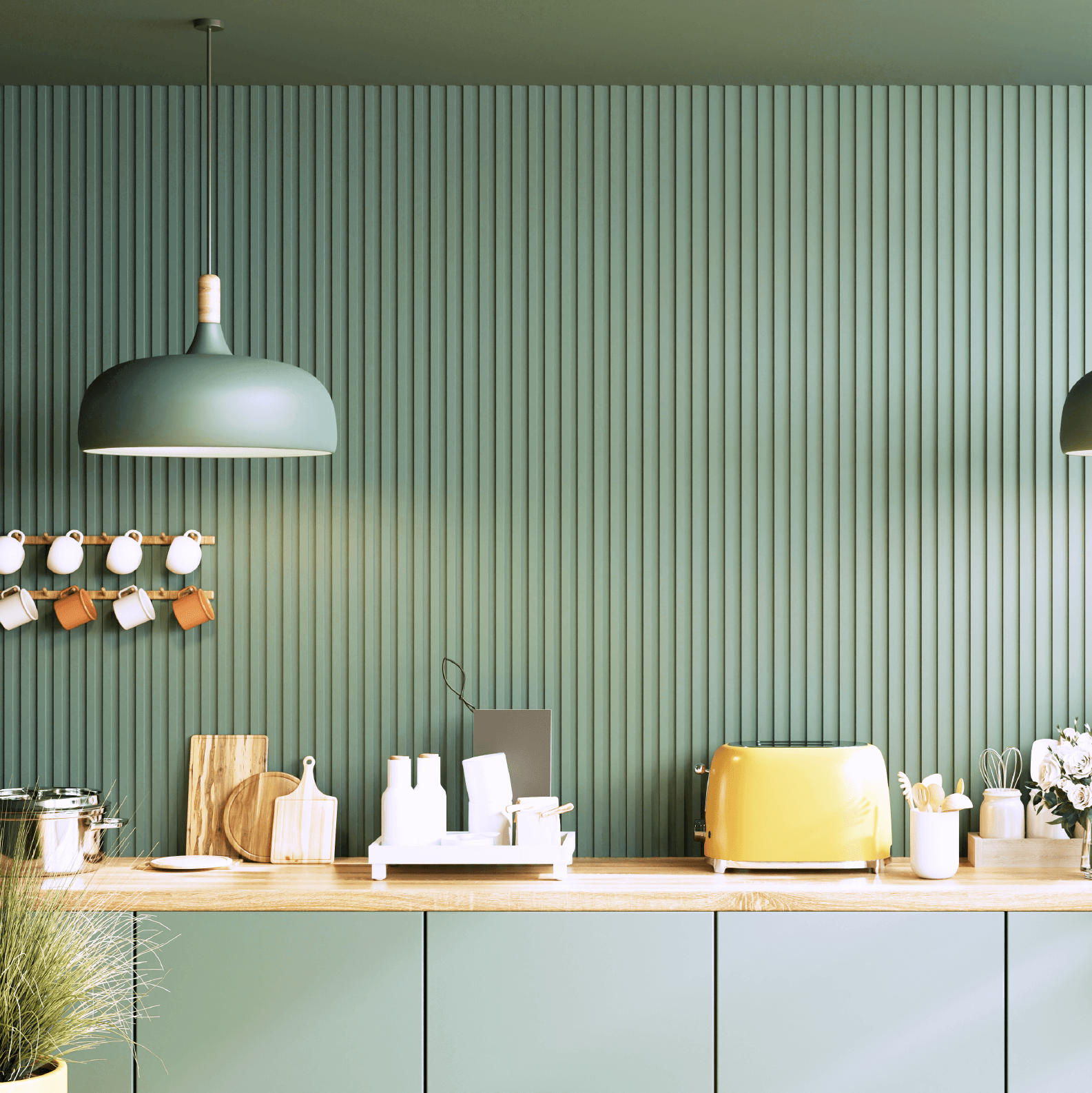 Wandfarbe Vintagegrün No. 650 Design Collection 5L edelmatt auf einer modernen Küchenwand mit Holzregal.